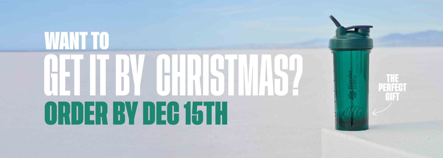 Green blender bottle on a snowy landscape, partially obscured by white text overlay: Want to get it by Christmas? Order by Dec 15th. Close-up of signage elements visible in the background.