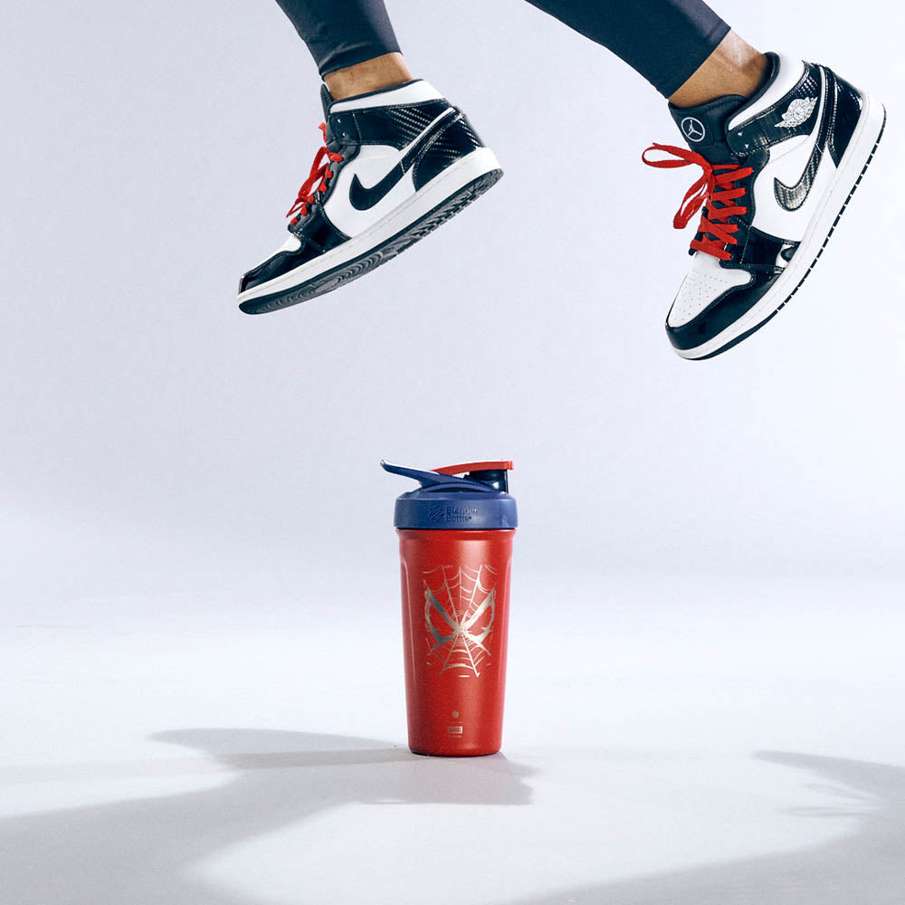 Man jumping over Spider-Man insulated shaker bottle