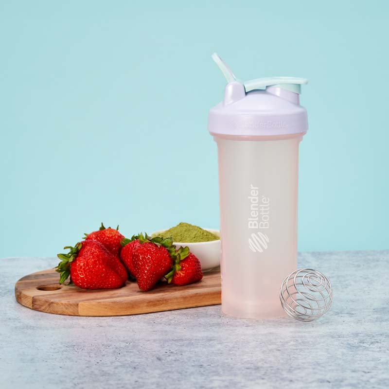 Pastel pink, purple, and blue color of the month shaker with strawberries and matcha