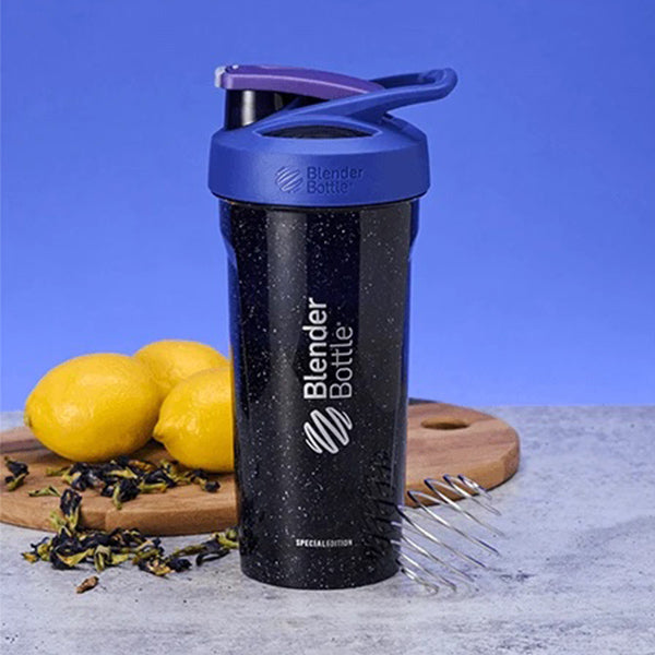 Galaxy shaker bottle with lemons on cutting board