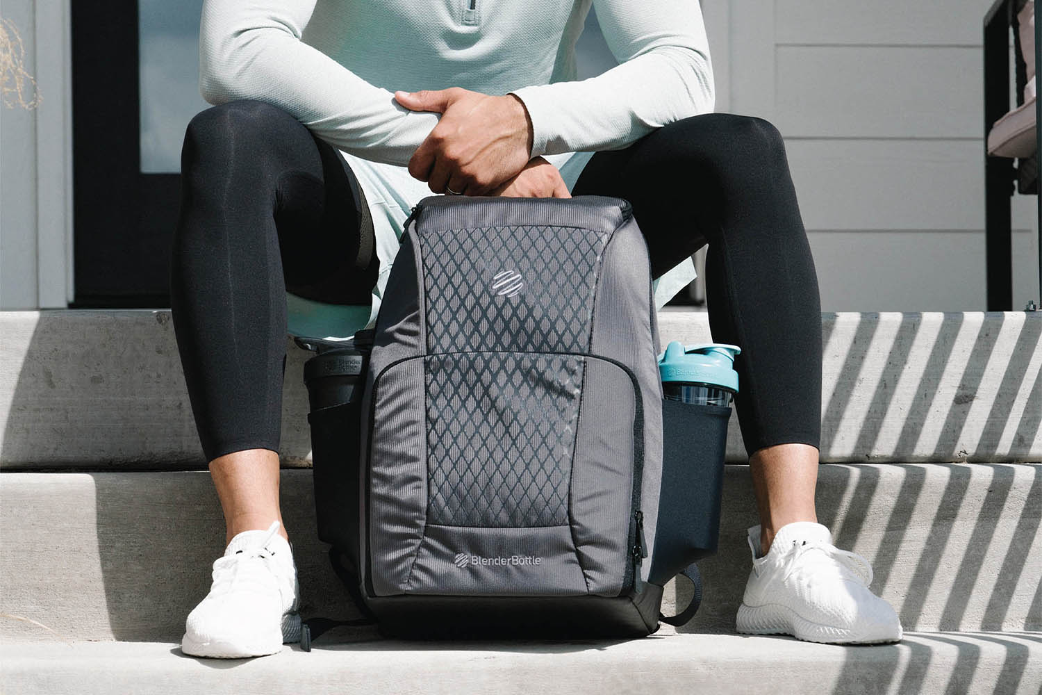 Man holding a BlenderBottle Meal Bag Backpack