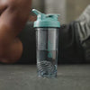 BlenderBottle products showcased in video: shaker cups, insulated bottles, water jugs. Various angles & features highlighted.